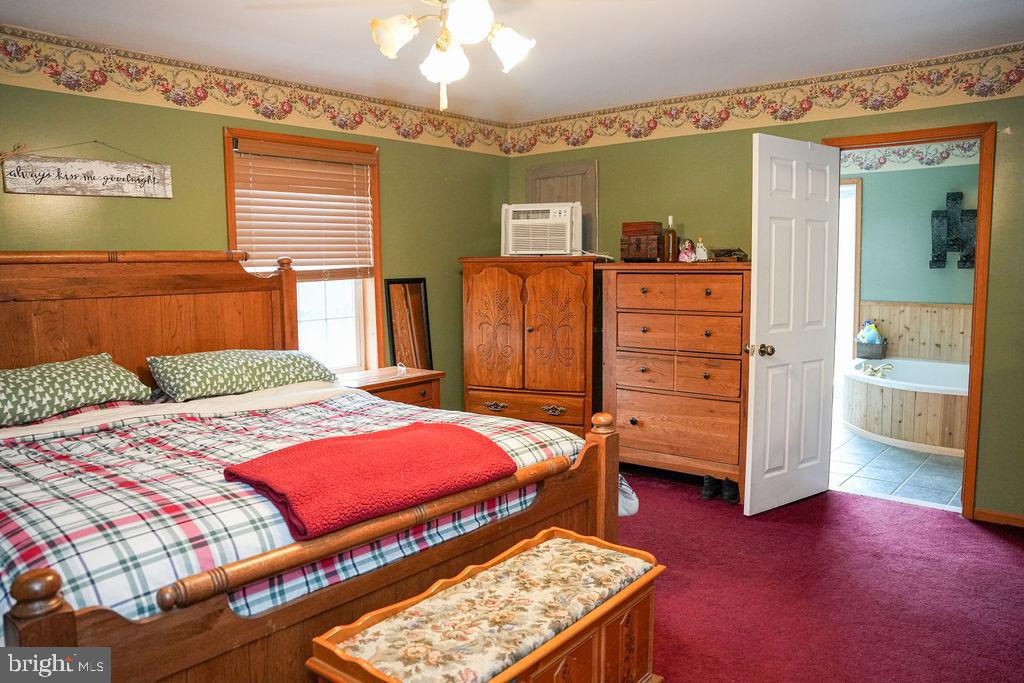 76 Northville Road Bridgeton, NJ 08302 - Photo 48 of 63 a bedroom with a bed and a table