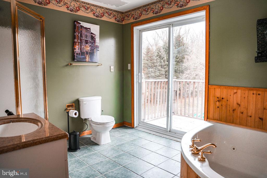 76 Northville Road Bridgeton, NJ 08302 - Photo 51 of 63 a bathroom with a sink a toilet and a window