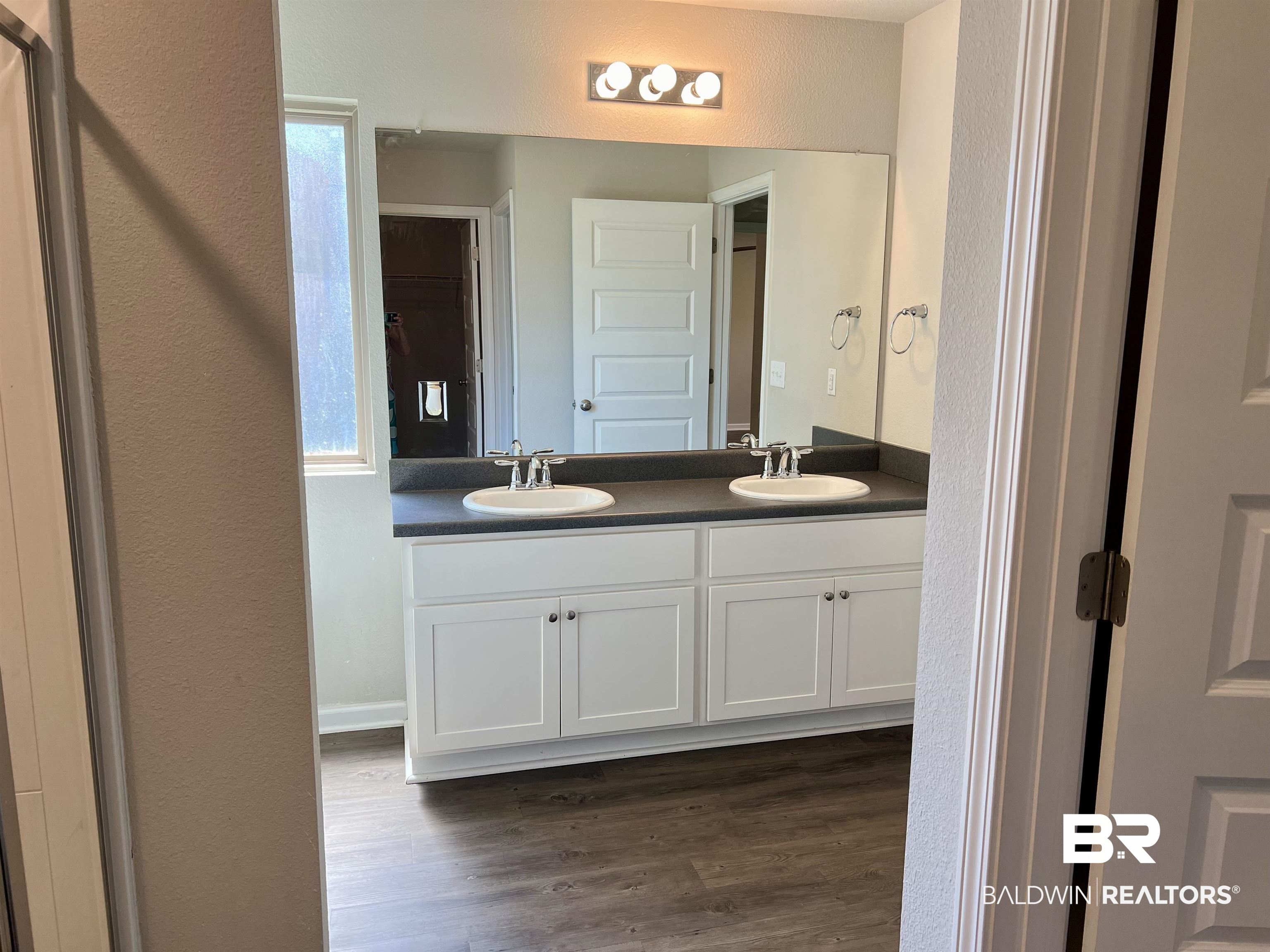 1612 Abbey Loop Foley, AL 36535 - Photo 21 of 30 Bathroom with hardwood / wood-style flooring and dual bowl vanity