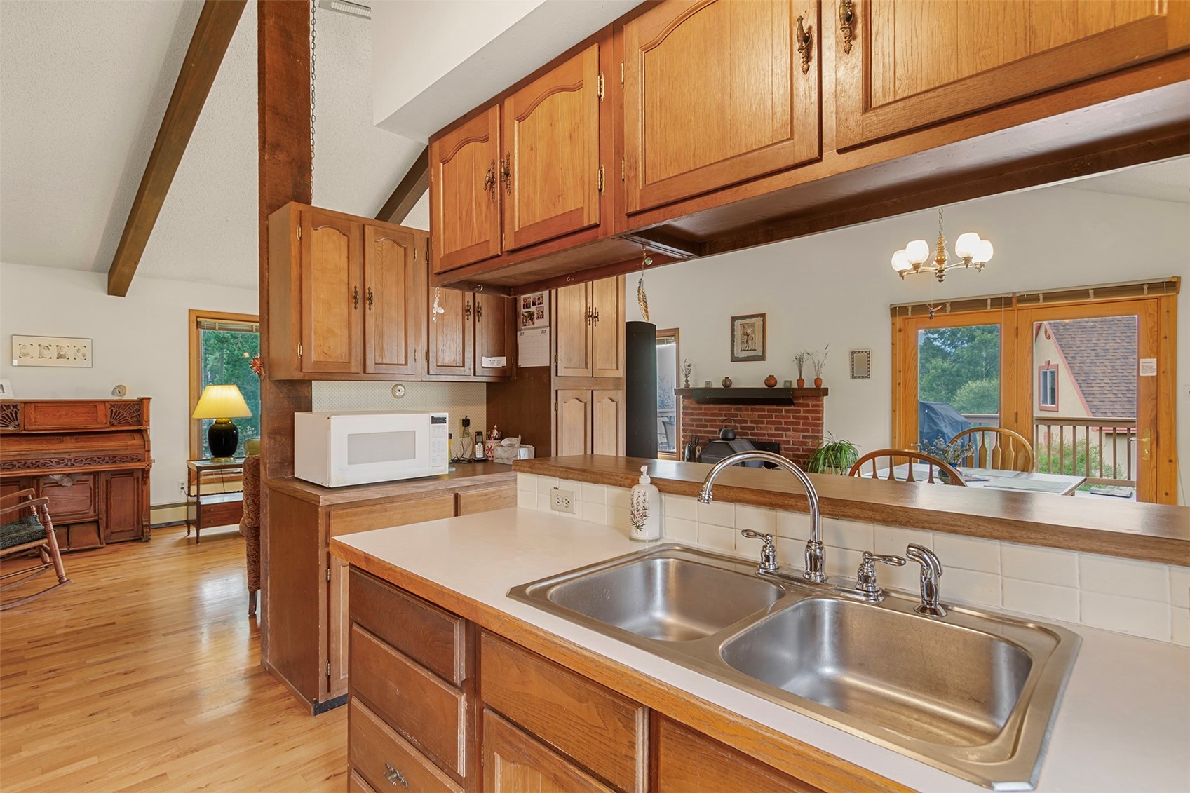 857 Deer Path Road Dillon, CO 80435 - Photo 12 of 29 Combined Living, dining, kitchen, with vaulted ceilings and access to deck with mountain views