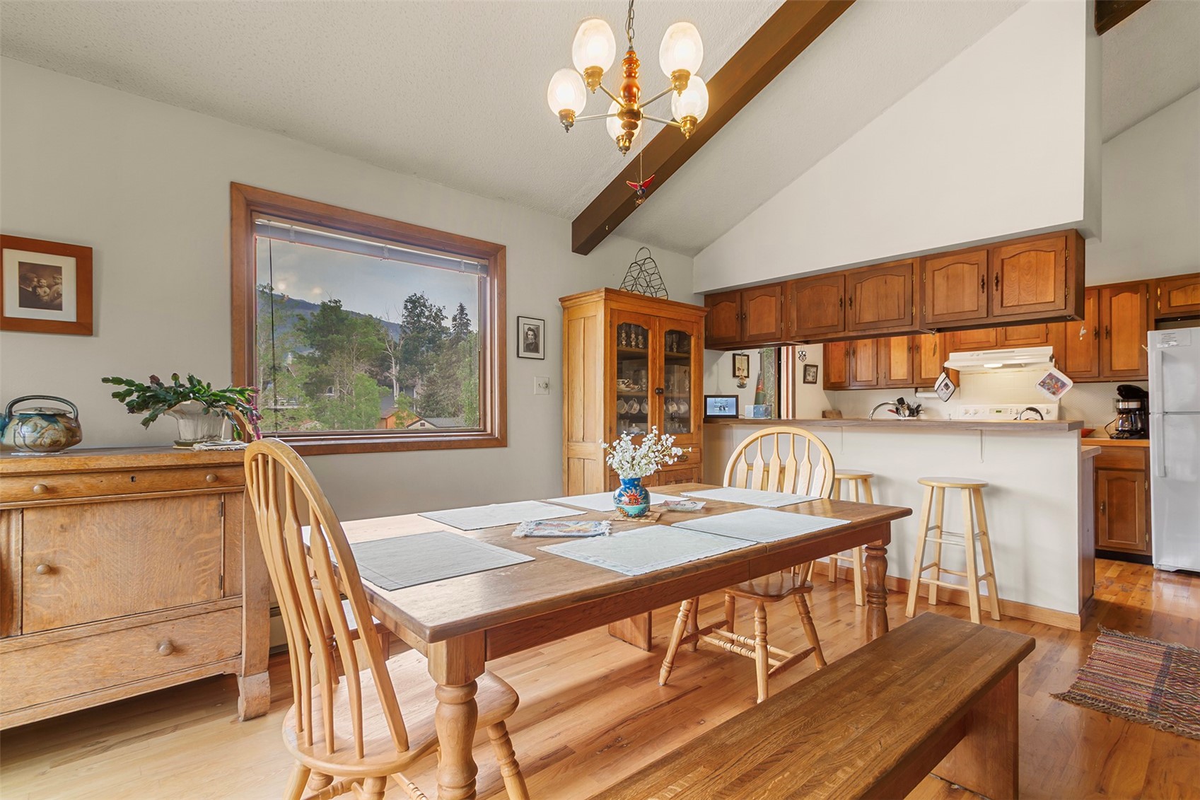 857 Deer Path Road Dillon, CO 80435 - Photo 8 of 29 Combined Living, dining, kitchen, with vaulted ceilings and access to deck with mountain views