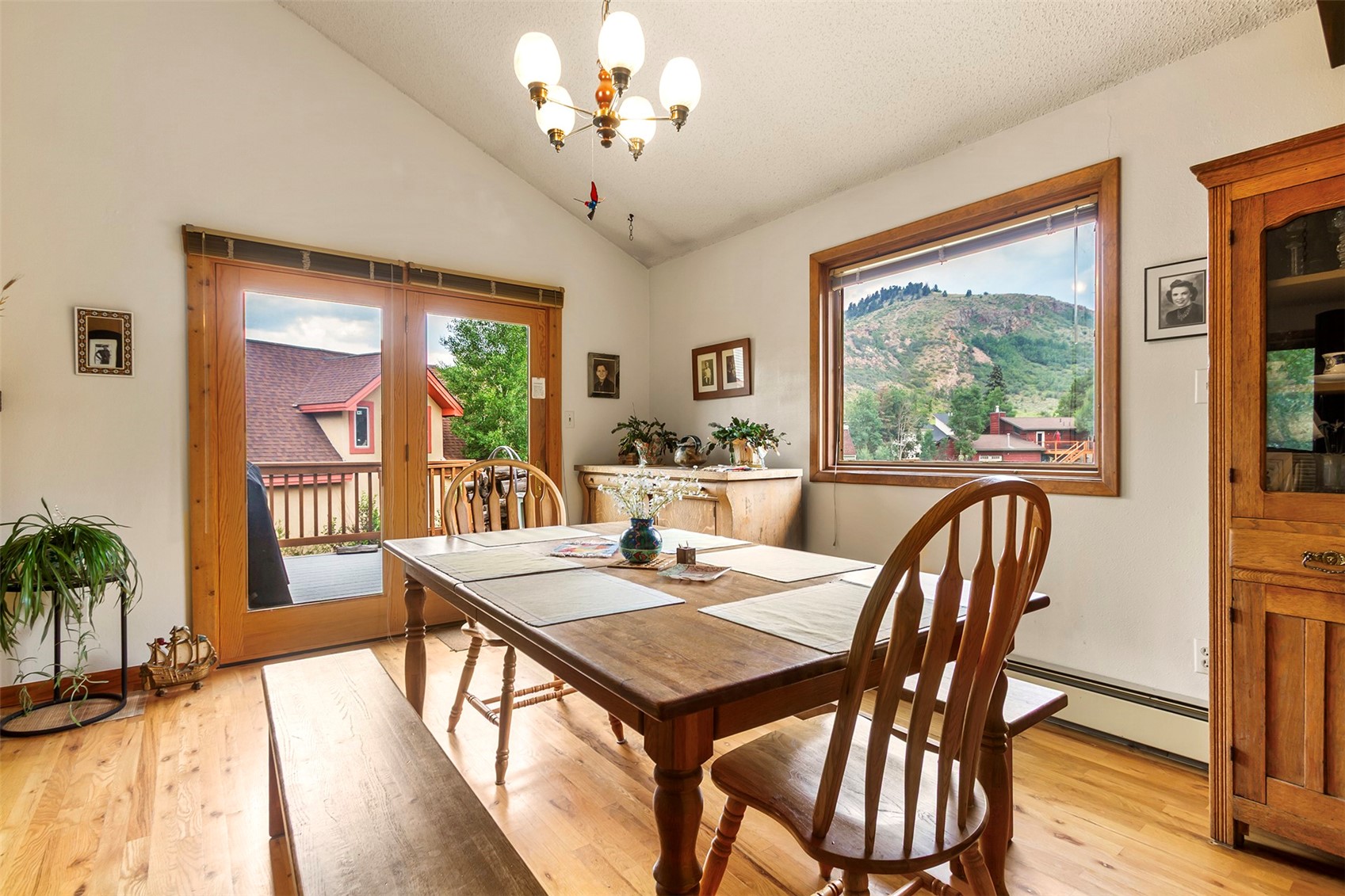 857 Deer Path Road Dillon, CO 80435 - Photo 10 of 29 Combined Living, dining, kitchen, with vaulted ceilings and access to deck with mountain views