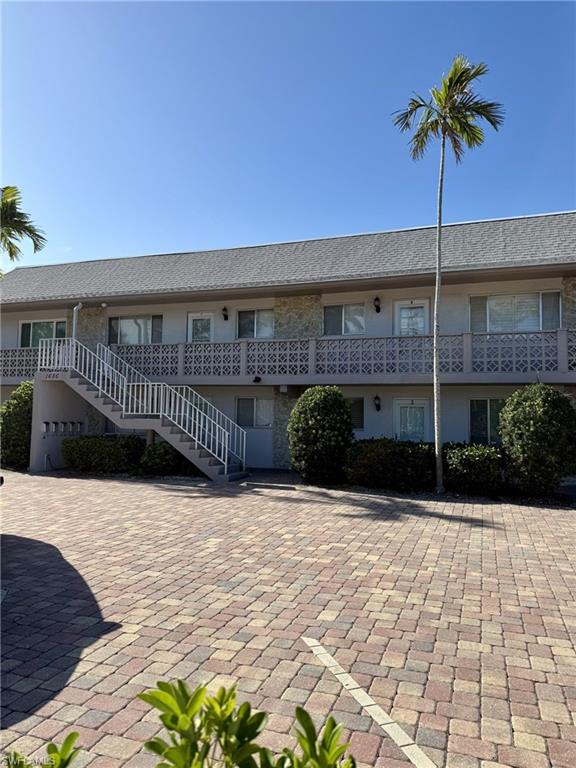 1686 Blue Point Avenue, Unit B7 Naples, FL 34102 - Photo 6 of 49 a view of a house with a patio