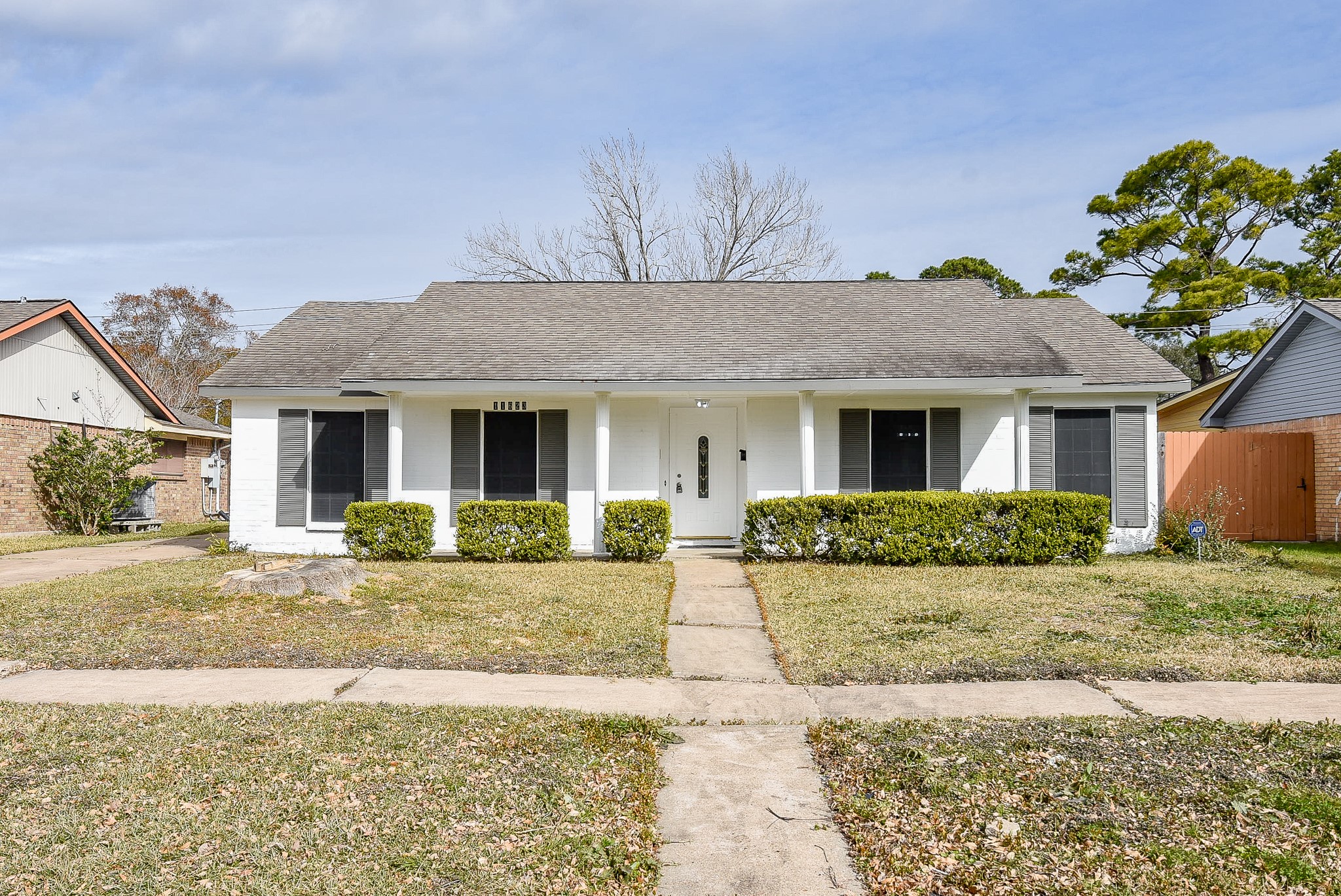 11623 Kirkhollow Drive Houston, TX 77089 - Photo 2 of 32 a front view of a house with a yard and potted plants