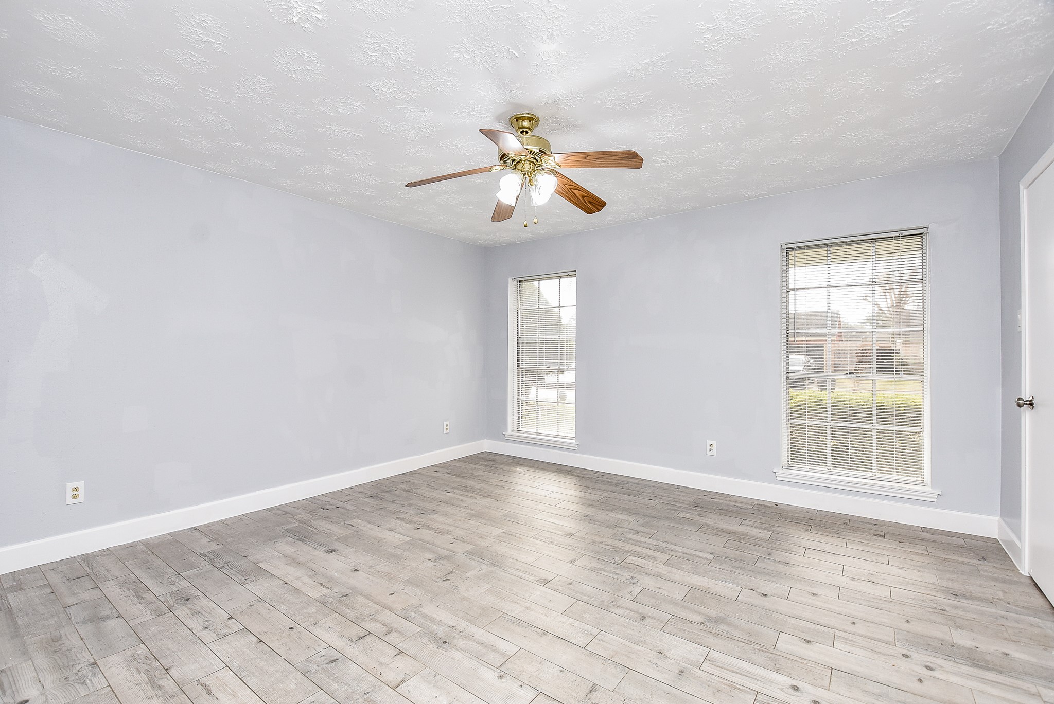 11623 Kirkhollow Drive Houston, TX 77089 - Photo 25 of 32 wooden floor in an empty room with a window