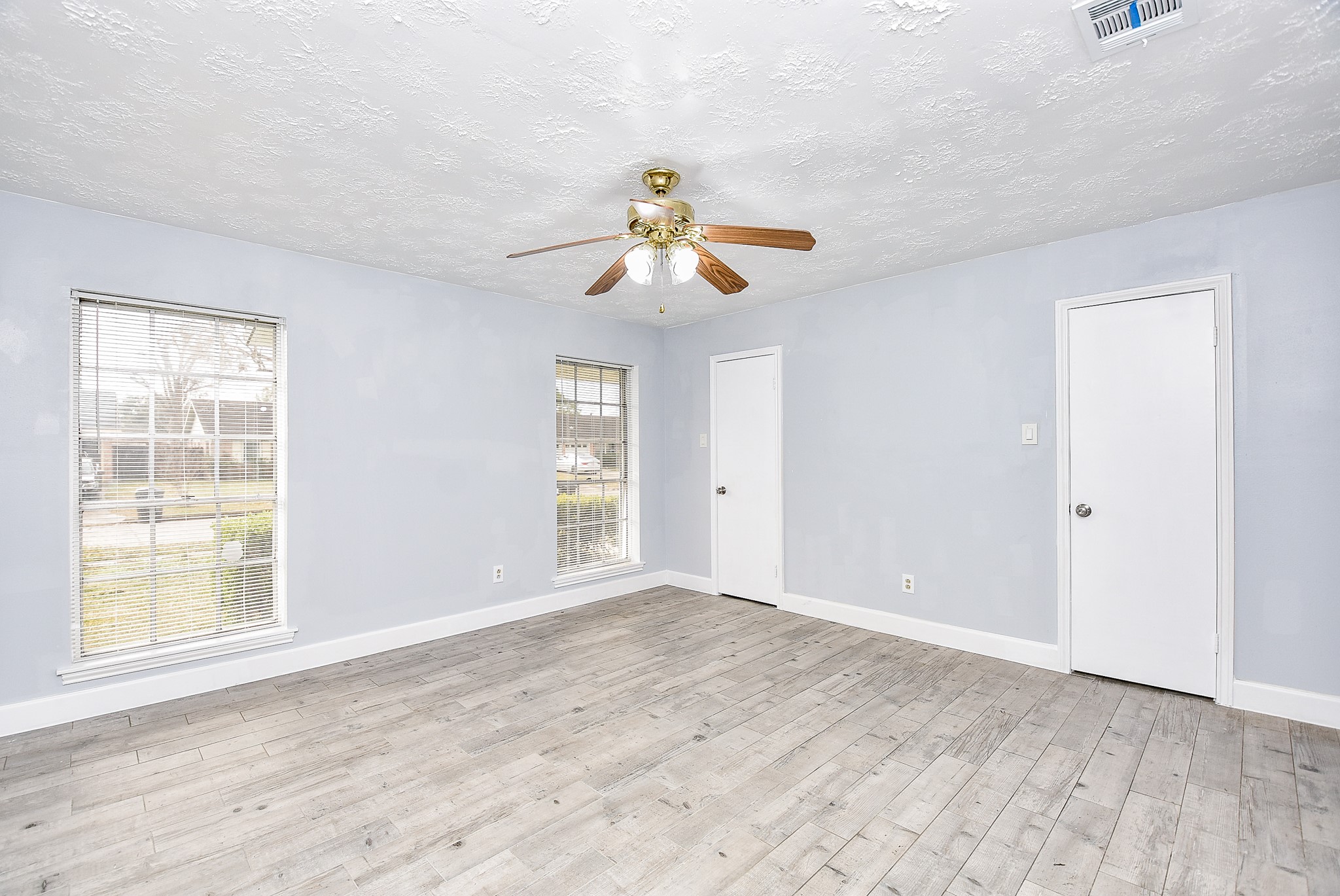 11623 Kirkhollow Drive Houston, TX 77089 - Photo 26 of 32 a view of a room with a window and a ceiling fan