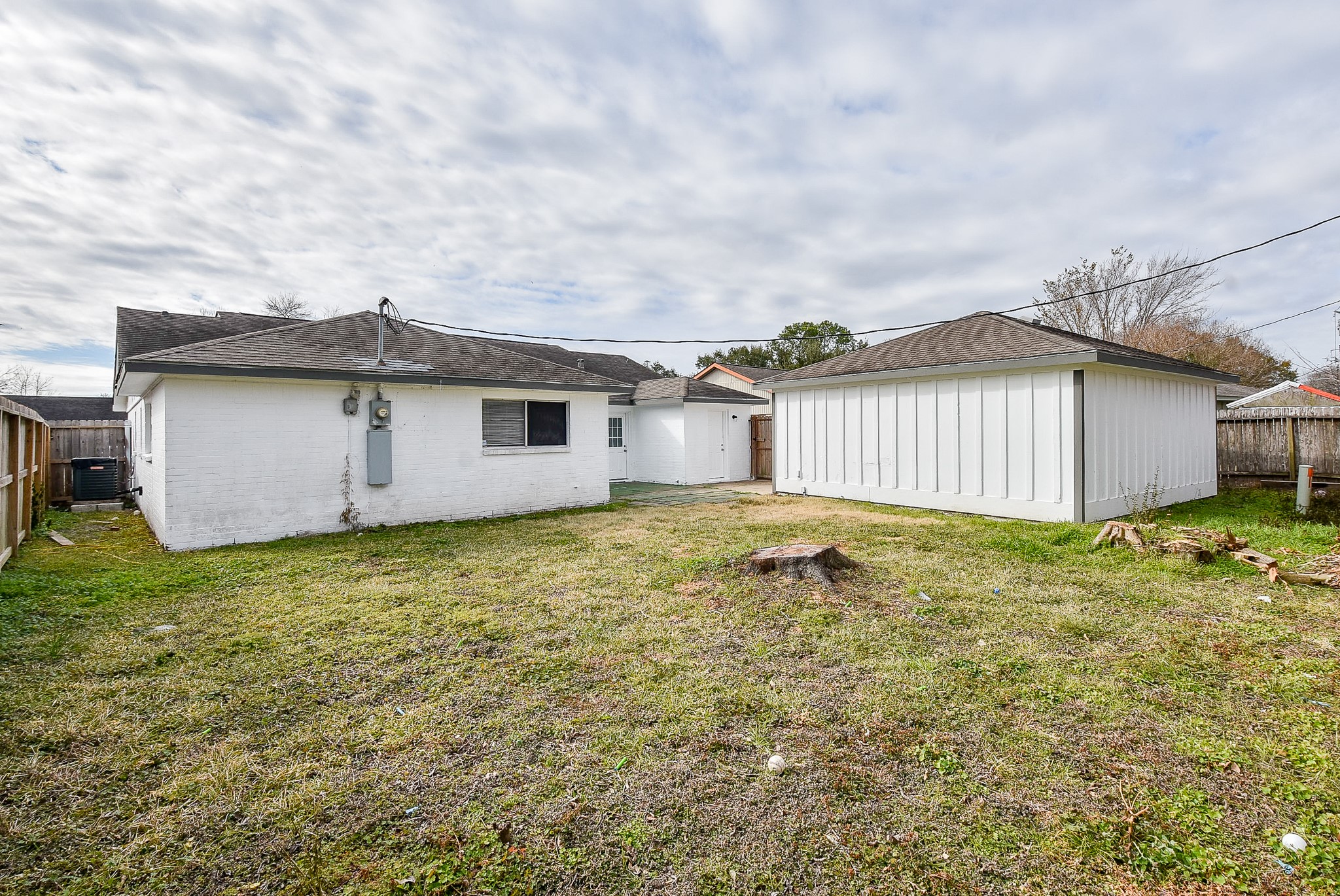 11623 Kirkhollow Drive Houston, TX 77089 - Photo 32 of 32 a view of a backyard with a garden and garage