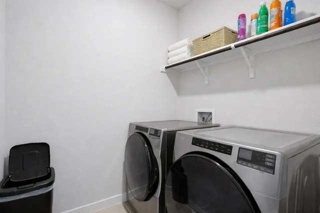 a utility room with dryer and washer