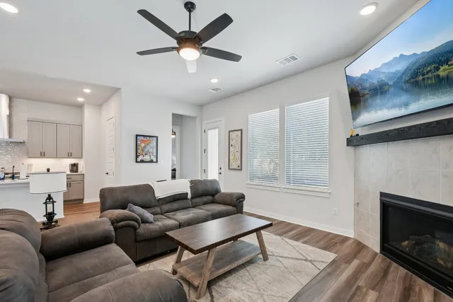 a living room with furniture and a fireplace