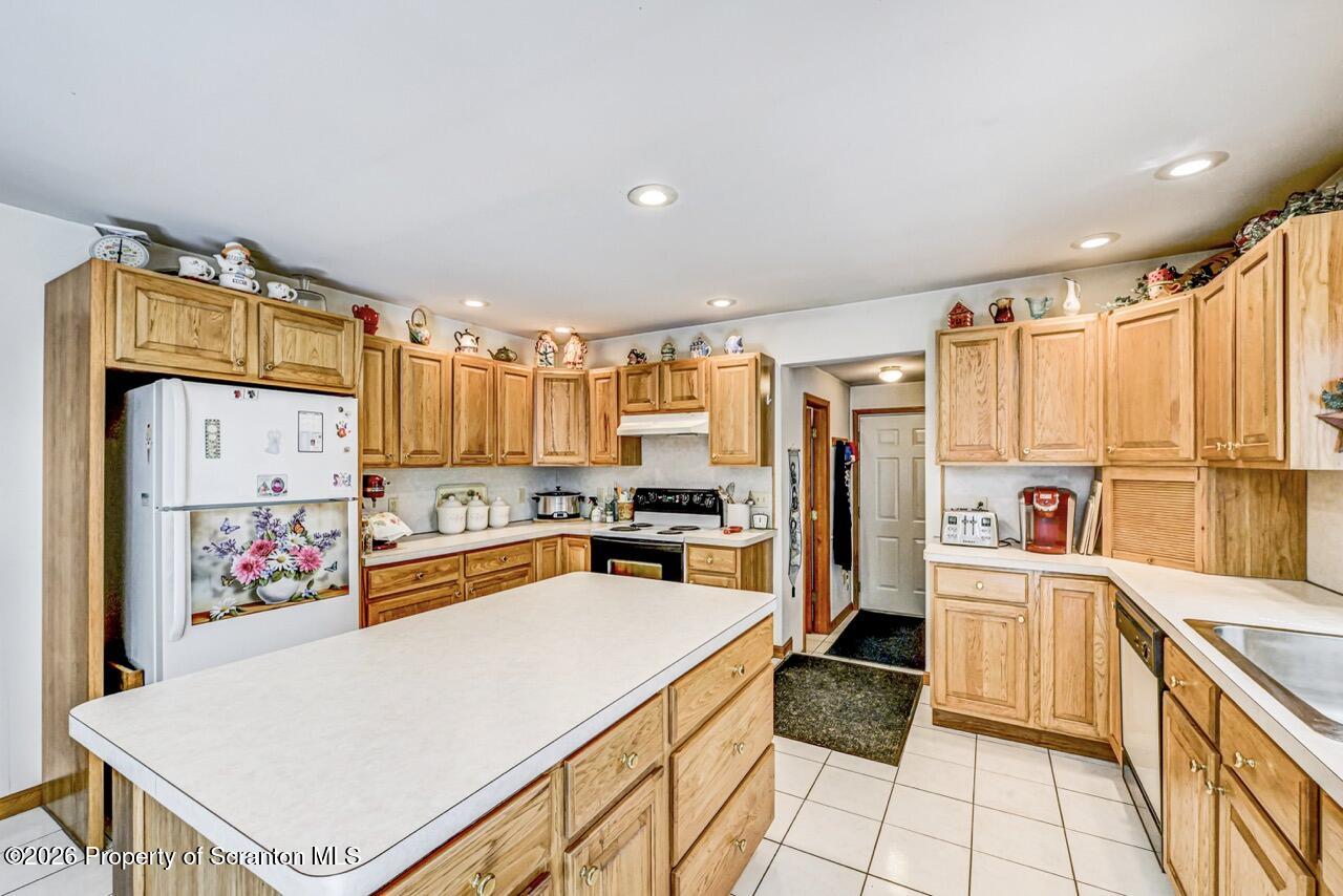 314 Reynolds Road Factoryville, PA 18419 - Photo 20 of 58 a kitchen that has a lot of cabinets and wooden floor