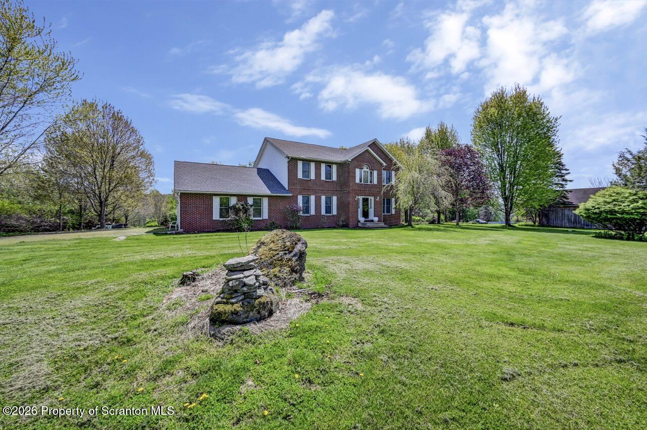 314 Reynolds Road Factoryville, PA 18419 - Photo 2 of 58 a view of a house with a big yard
