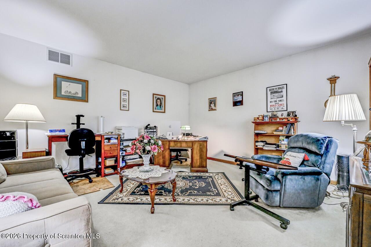 314 Reynolds Road Factoryville, PA 18419 - Photo 4 of 58 a living room with furniture and a wooden floor