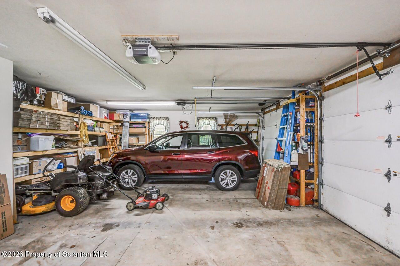 314 Reynolds Road Factoryville, PA 18419 - Photo 45 of 58 a view of parking garage with cars and parked car