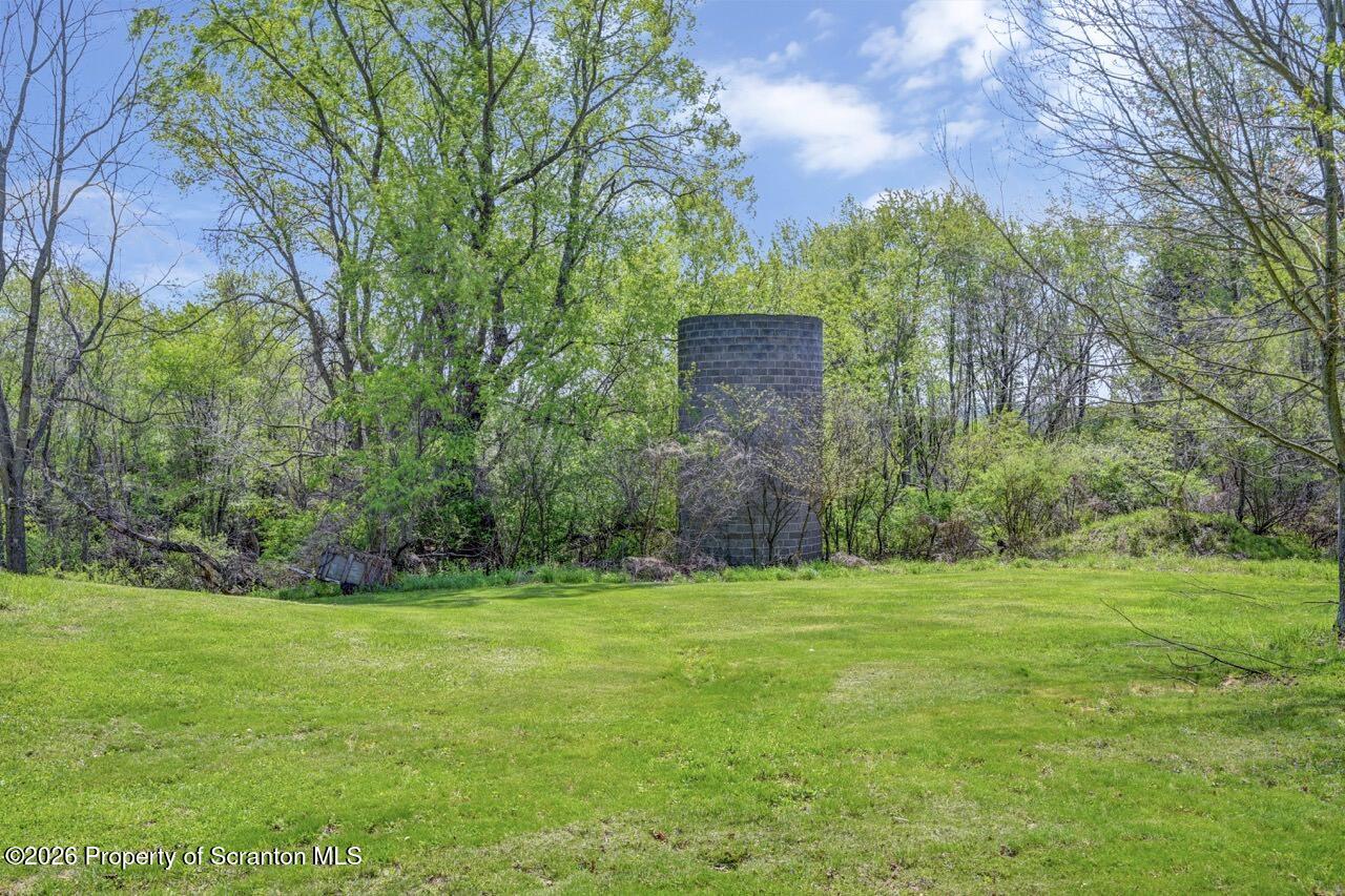 314 Reynolds Road Factoryville, PA 18419 - Photo 51 of 58 a building with a big yard and large trees
