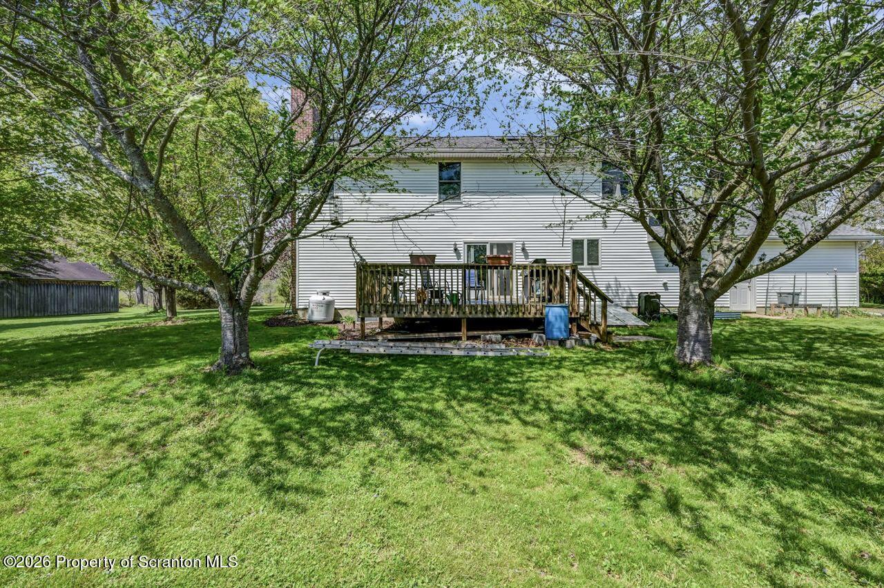314 Reynolds Road Factoryville, PA 18419 - Photo 54 of 58 a view of house with a yard