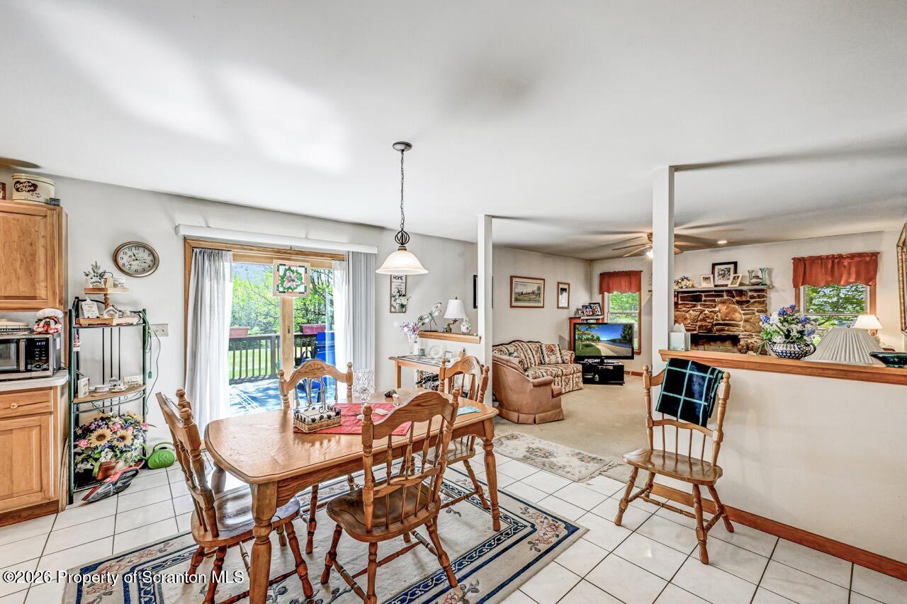 314 Reynolds Road Factoryville, PA 18419 - Photo 6 of 58 a view of a dining room with furniture window and outside view