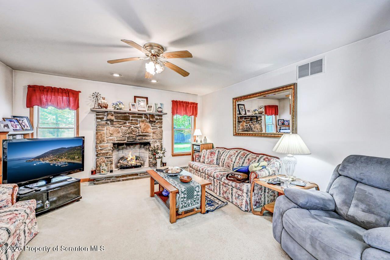 314 Reynolds Road Factoryville, PA 18419 - Photo 7 of 58 a living room with furniture and a flat screen tv
