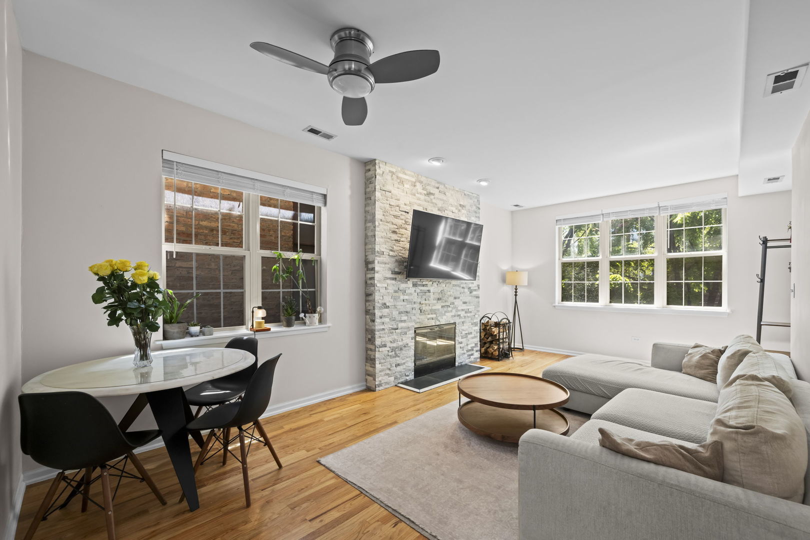 2710 West Haddon Avenue, Unit 2 Chicago, IL 60622 - Photo 2 of 11 a living room with furniture fireplace and a flat screen tv