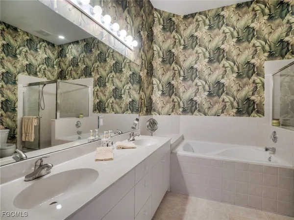 a bathroom with a bathtub and a sink