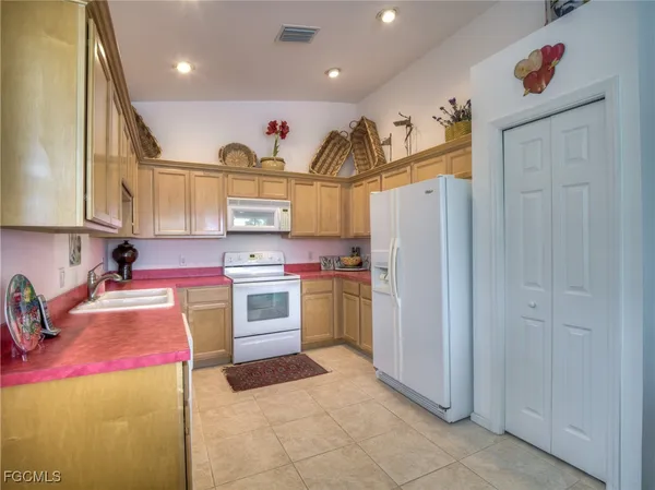 a open kitchen with stainless steel appliances granite countertop a stove and cabinets