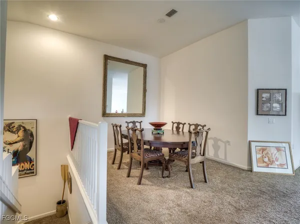 a dining room with furniture and window