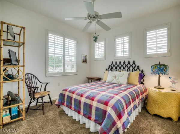 a bedroom with bed and a window