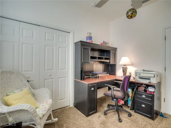 a view of a workspace with furniture