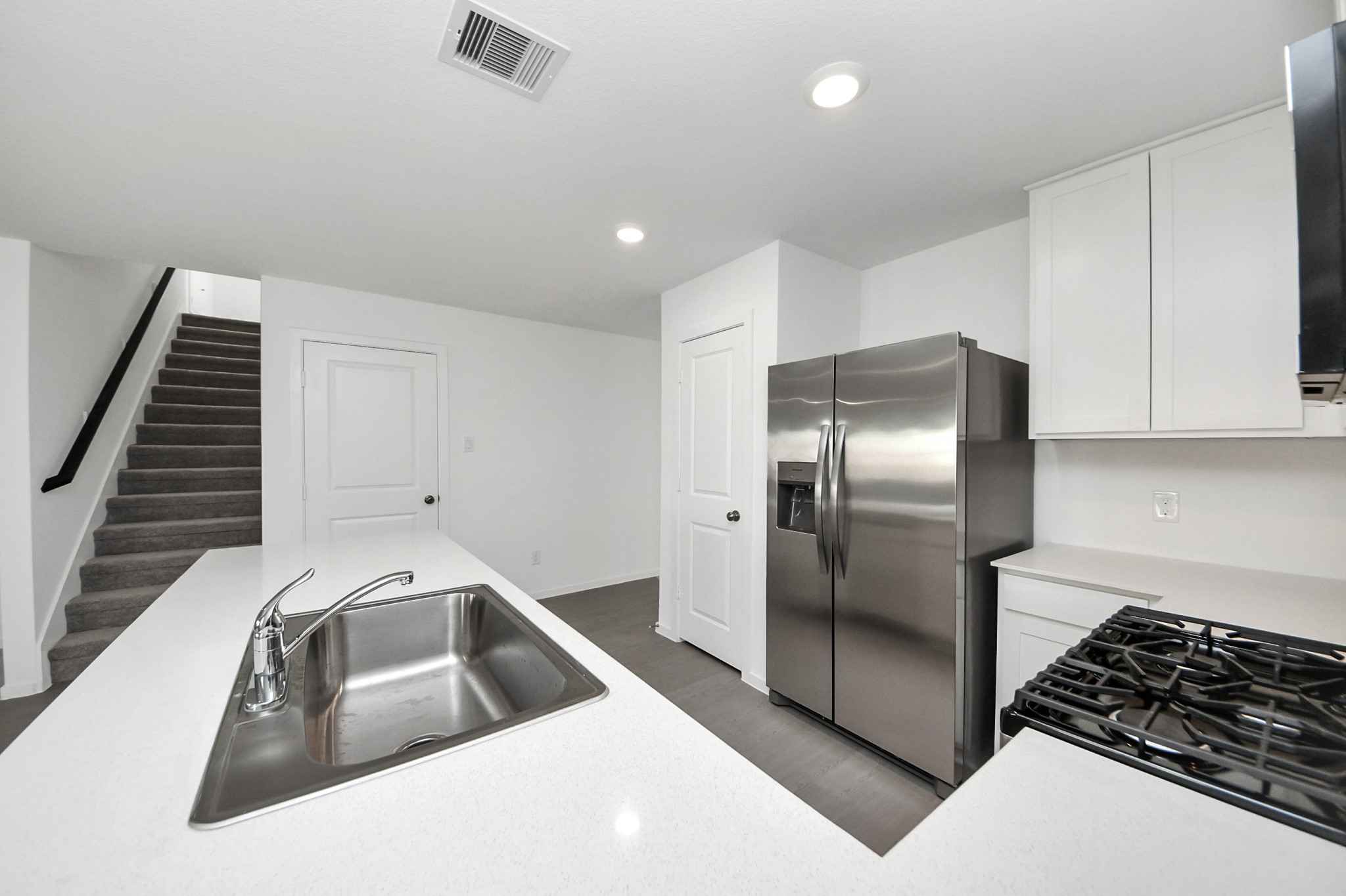 2523 Night Emerald Drive Rosharon, TX 77583 - Photo 15 of 42 a kitchen with a sink and a refrigerator