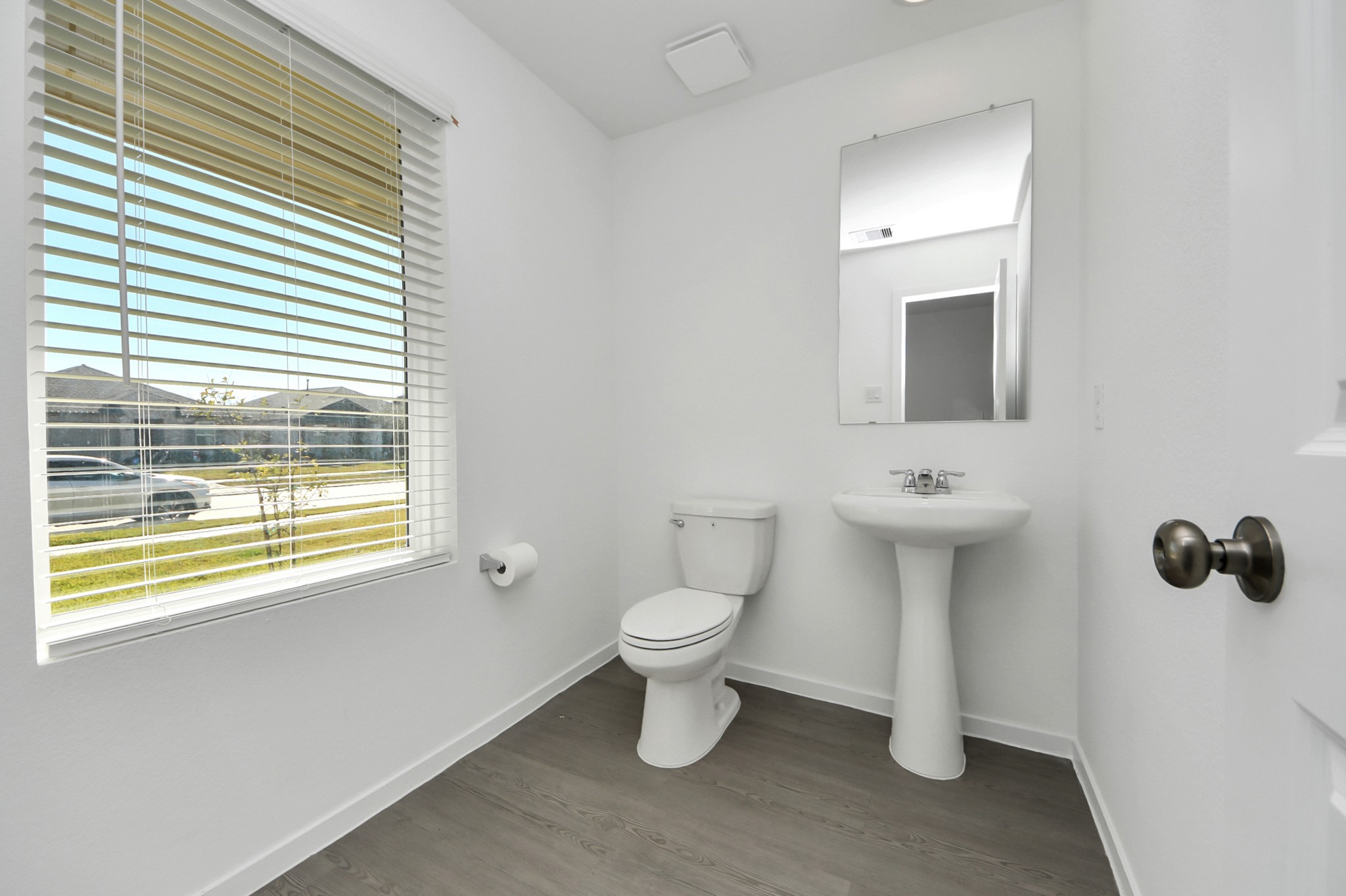 2523 Night Emerald Drive Rosharon, TX 77583 - Photo 25 of 42 a bathroom with a toilet sink and mirror