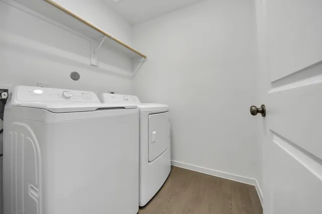 an aerial view of residential houses with outdoor space and swimming pool