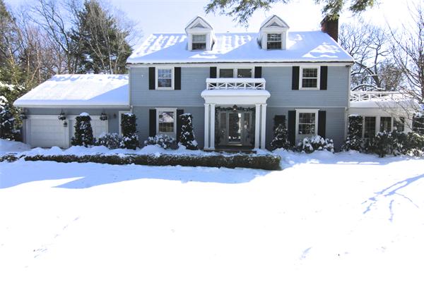 64 Myopia Road Winchester, MA 01890 - Photo 1 of 30 a front view of a house with yard covered in snow
