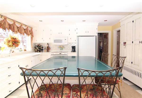 64 Myopia Road Winchester, MA 01890 - Photo 13 of 30 a view of a dining room with furniture and wooden floor