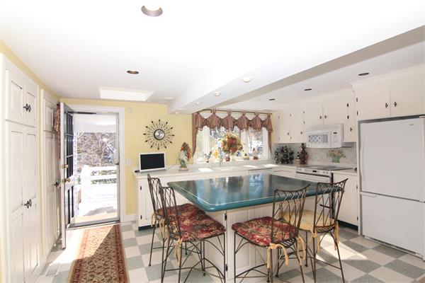 64 Myopia Road Winchester, MA 01890 - Photo 15 of 30 a view of a dining room with furniture large window and refrigerator