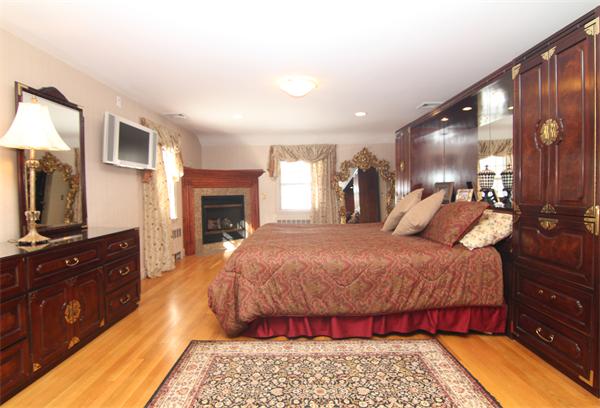 64 Myopia Road Winchester, MA 01890 - Photo 22 of 30 a bed room with a bed and a television