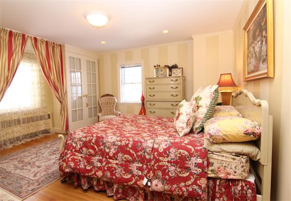 64 Myopia Road Winchester, MA 01890 - Photo 25 of 30 a bedroom with a bed and window