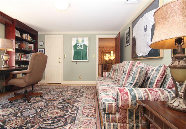 64 Myopia Road Winchester, MA 01890 - Photo 27 of 30 a bedroom with a large bed and a chair