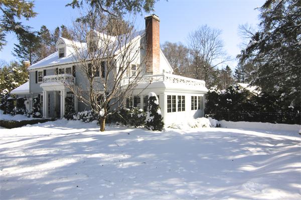 64 Myopia Road Winchester, MA 01890 - Photo 29 of 30 a view of a house with a yard covered in snow