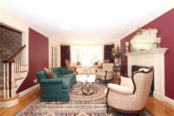64 Myopia Road Winchester, MA 01890 - Photo 6 of 30 a living room with furniture a fireplace and a large window