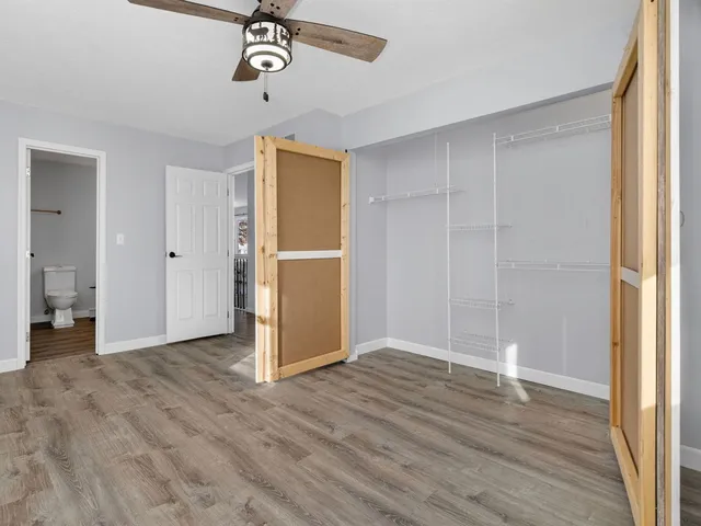a view of a livingroom with wooden floor