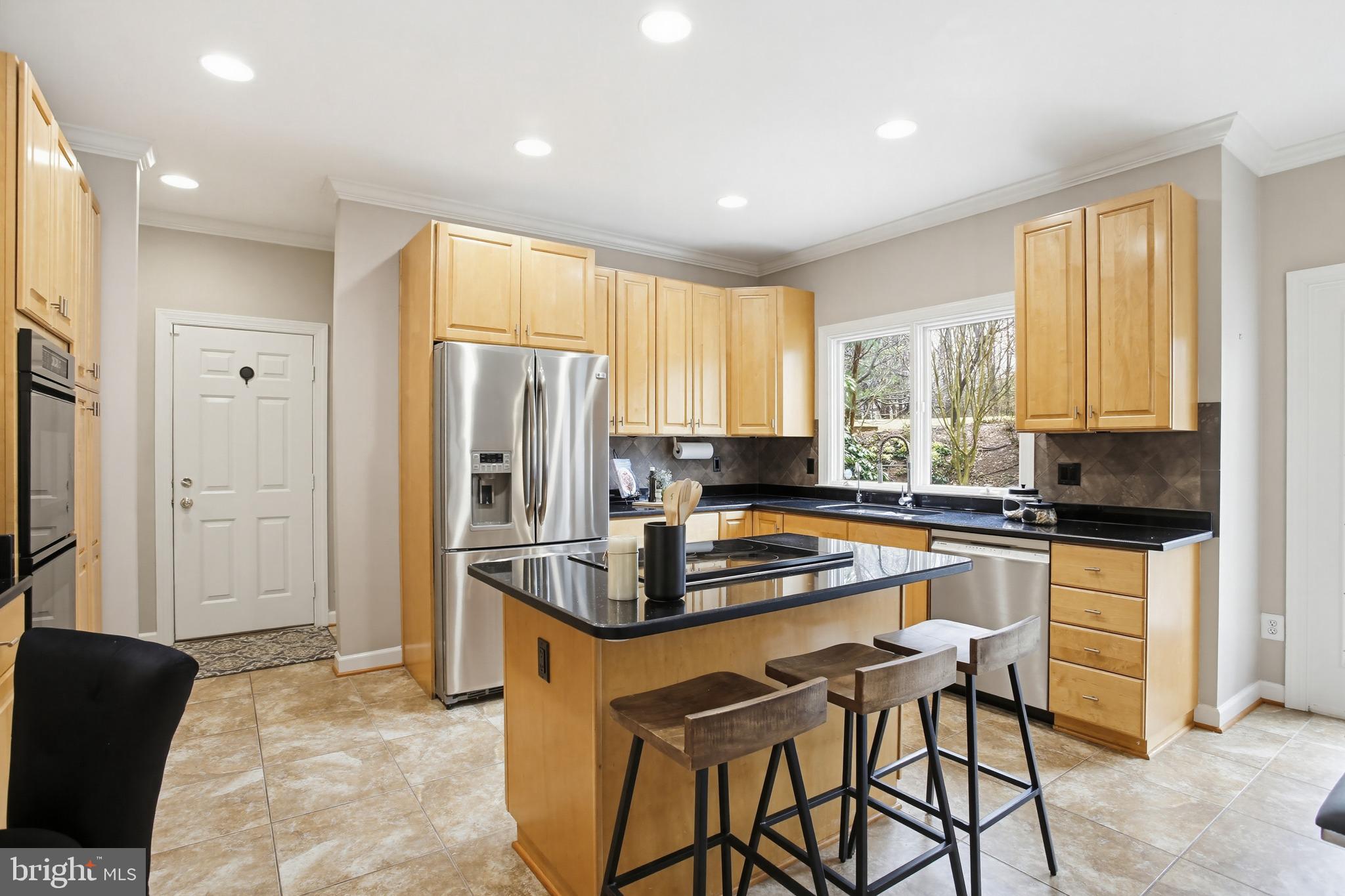 11316 Bright Pond Lane Reston, VA 20194 - Photo 14 of 48 Pull up a seat at the kitchen island
