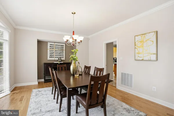 a view of a dining room with furniture and window