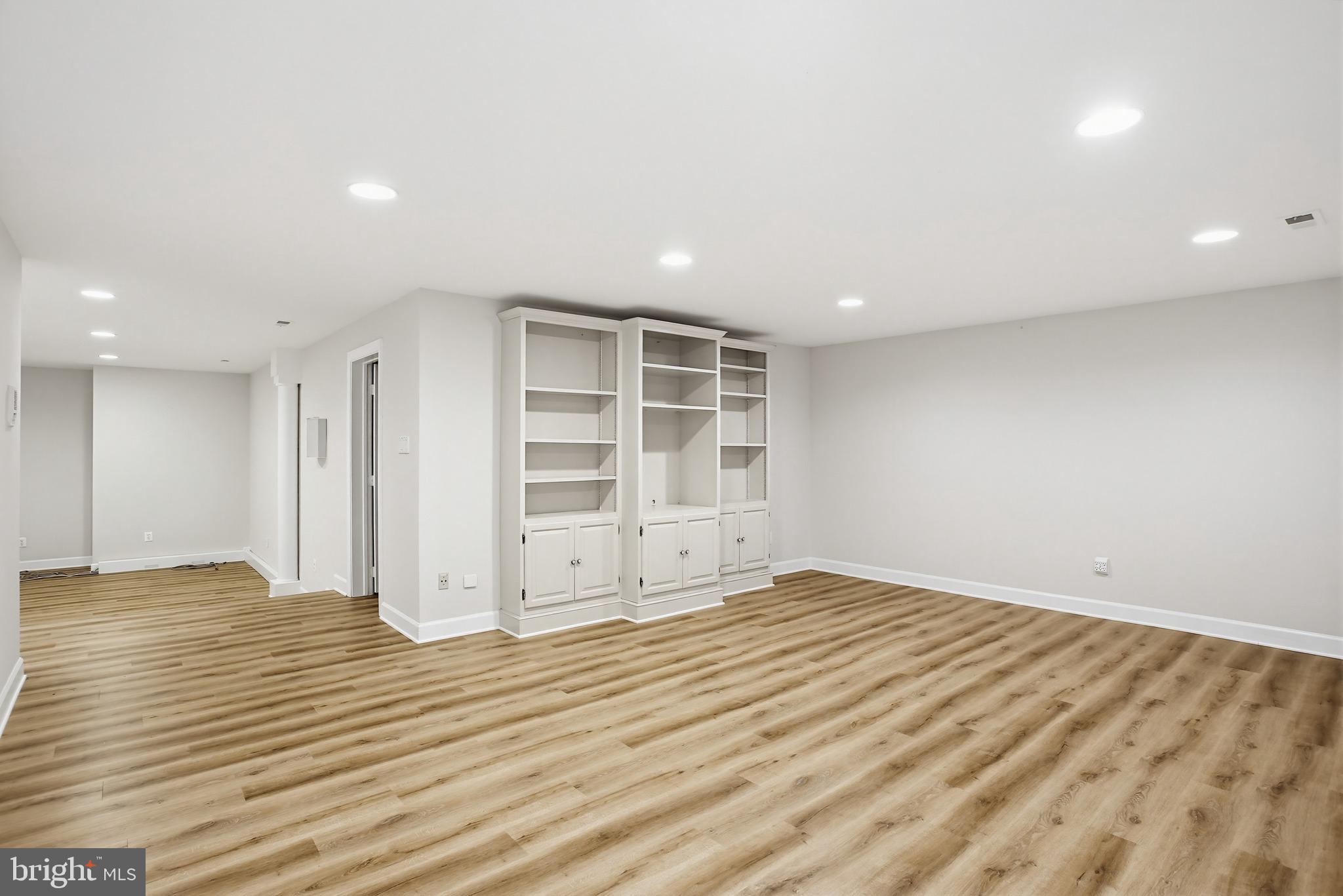 11316 Bright Pond Lane Reston, VA 20194 - Photo 31 of 48 The lower level has LVP flooring and builtins