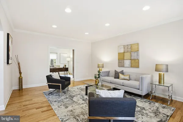 a living room with furniture and a rug