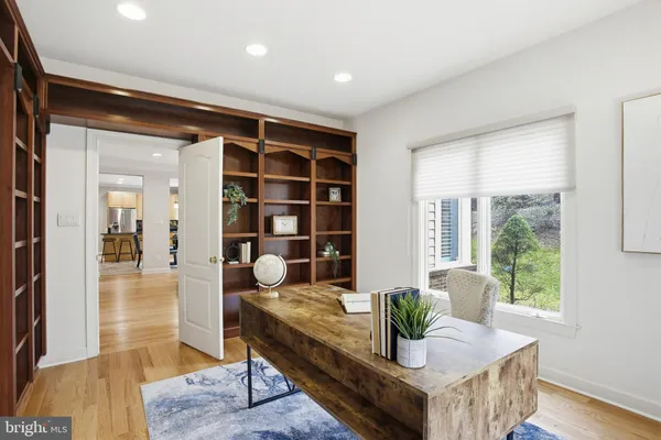 a living room with furniture and large window