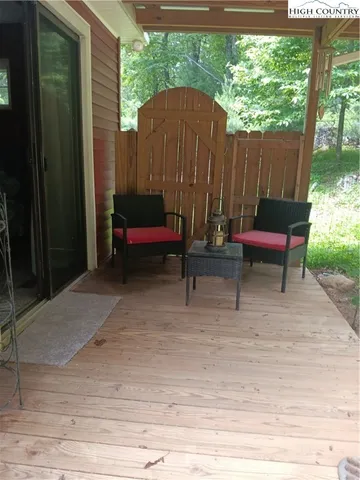 a backyard of a house with outdoor seating