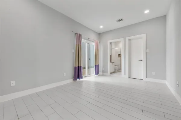 a view of a kitchen with a refrigerator and a window