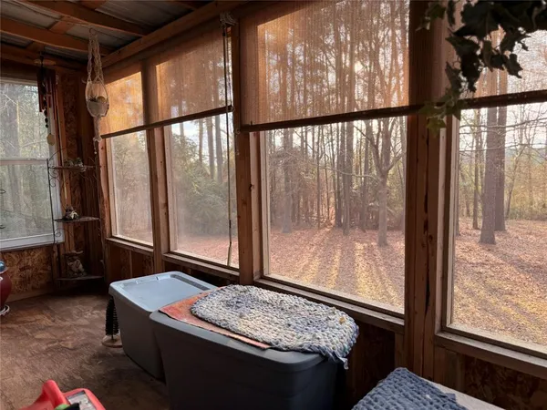 a view of a balcony with furniture
