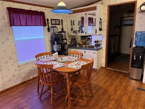 a dining room with furniture and window