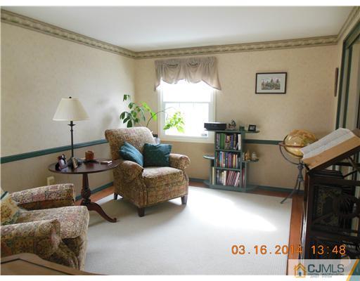 29 Hughes Road Somerset, NJ 08873 - Photo 15 of 19 a living room with furniture and a window