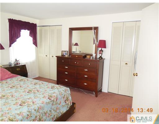 29 Hughes Road Somerset, NJ 08873 - Photo 18 of 19 a bedroom with a bed and a dresser